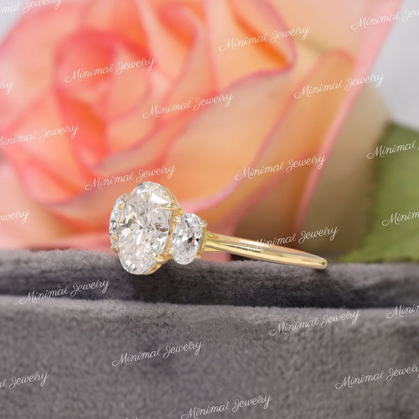 Oval Moissanite Three Stone Engagement Ring: 14k White Gold Trellis Setting