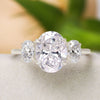 Oval Moissanite Three Stone Engagement Ring: 14k White Gold Trellis Setting
