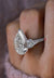 8ct Pear Moissanite Three Stone Engagement Ring: Hidden Halo, 14k White Gold